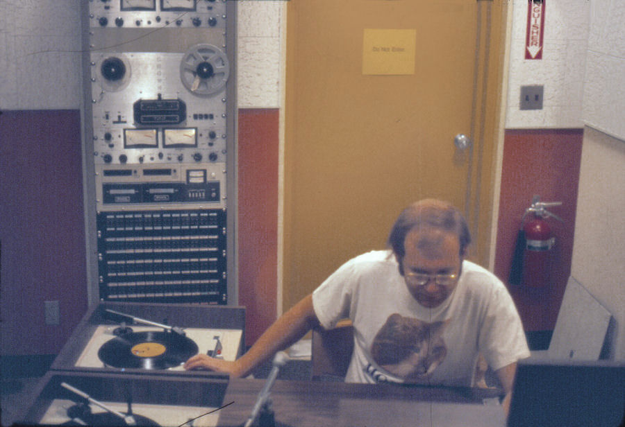Dave Wigfield at KCHO Studio with Sparta Centurian Cart Machines and Crown 700 Tape Machines in Background